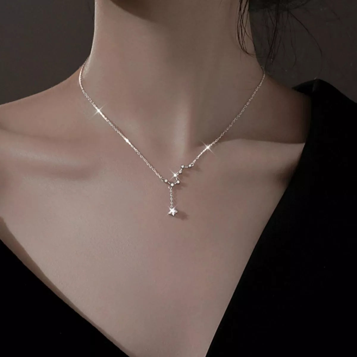 Zircon star pendant necklace in 925 sterling silver on model's neck close-up