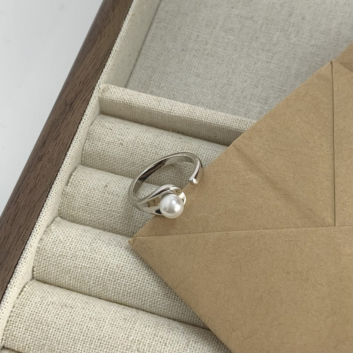 Detail shot of freshwater pearl texture and polished sterling silver band
