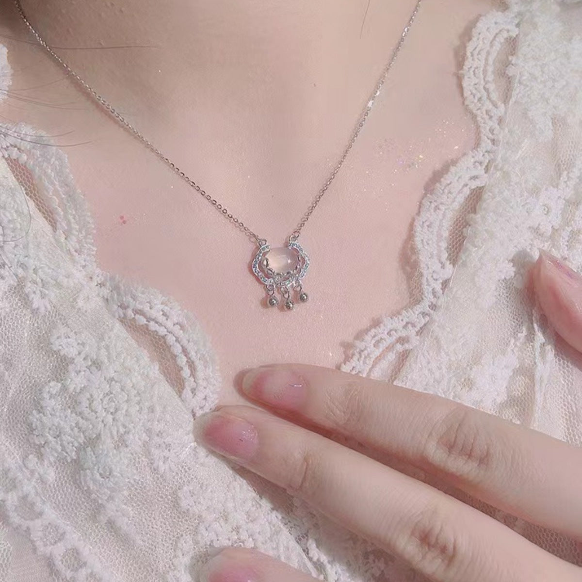 Close-up of 925 sterling silver lock charm with zircon and chalcedony accents