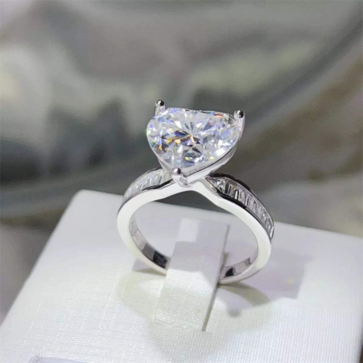 5ct heart moissanite ring stacked with other jewelry rebellious vibe