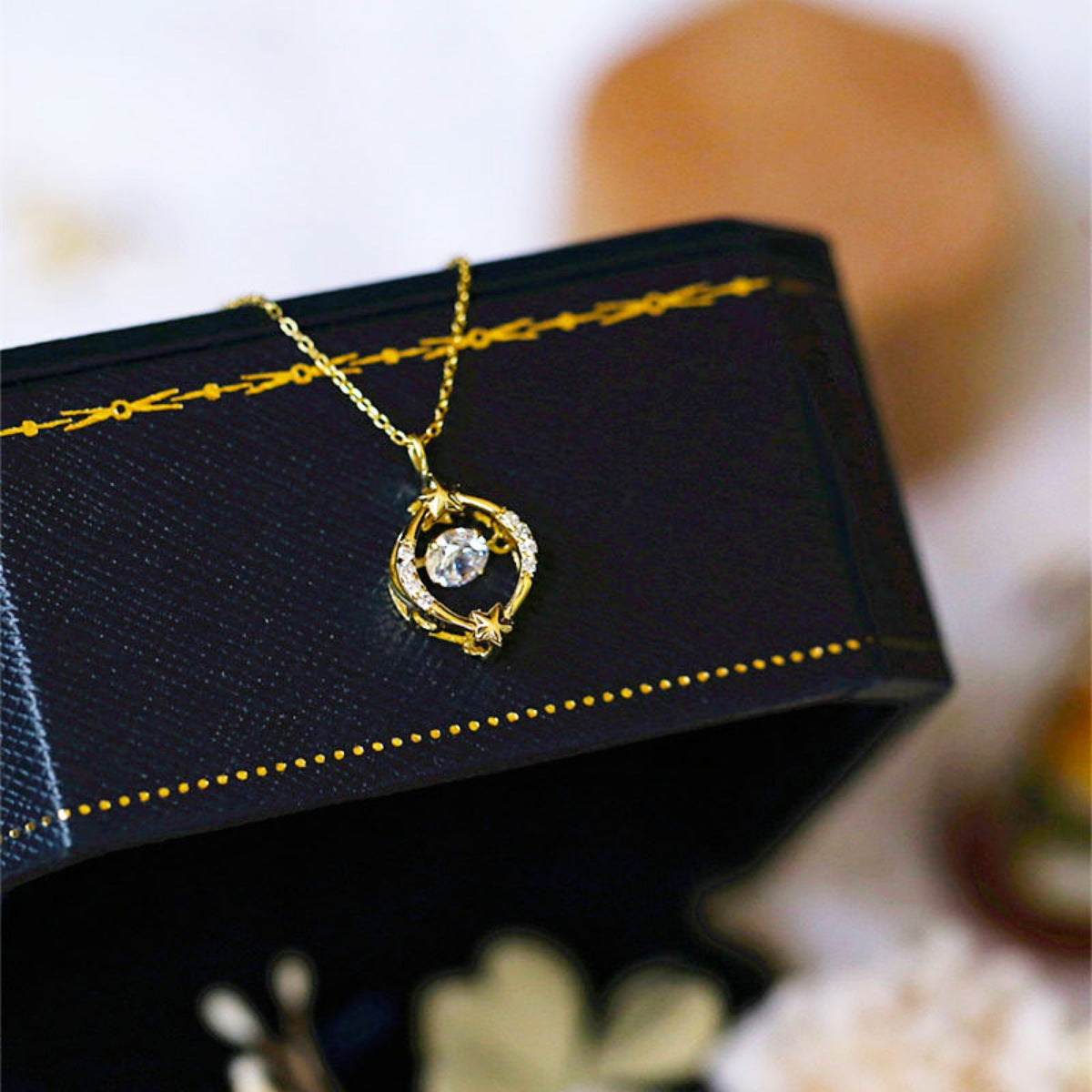 Detail of sparkling zircon stones on gold-plated pendant