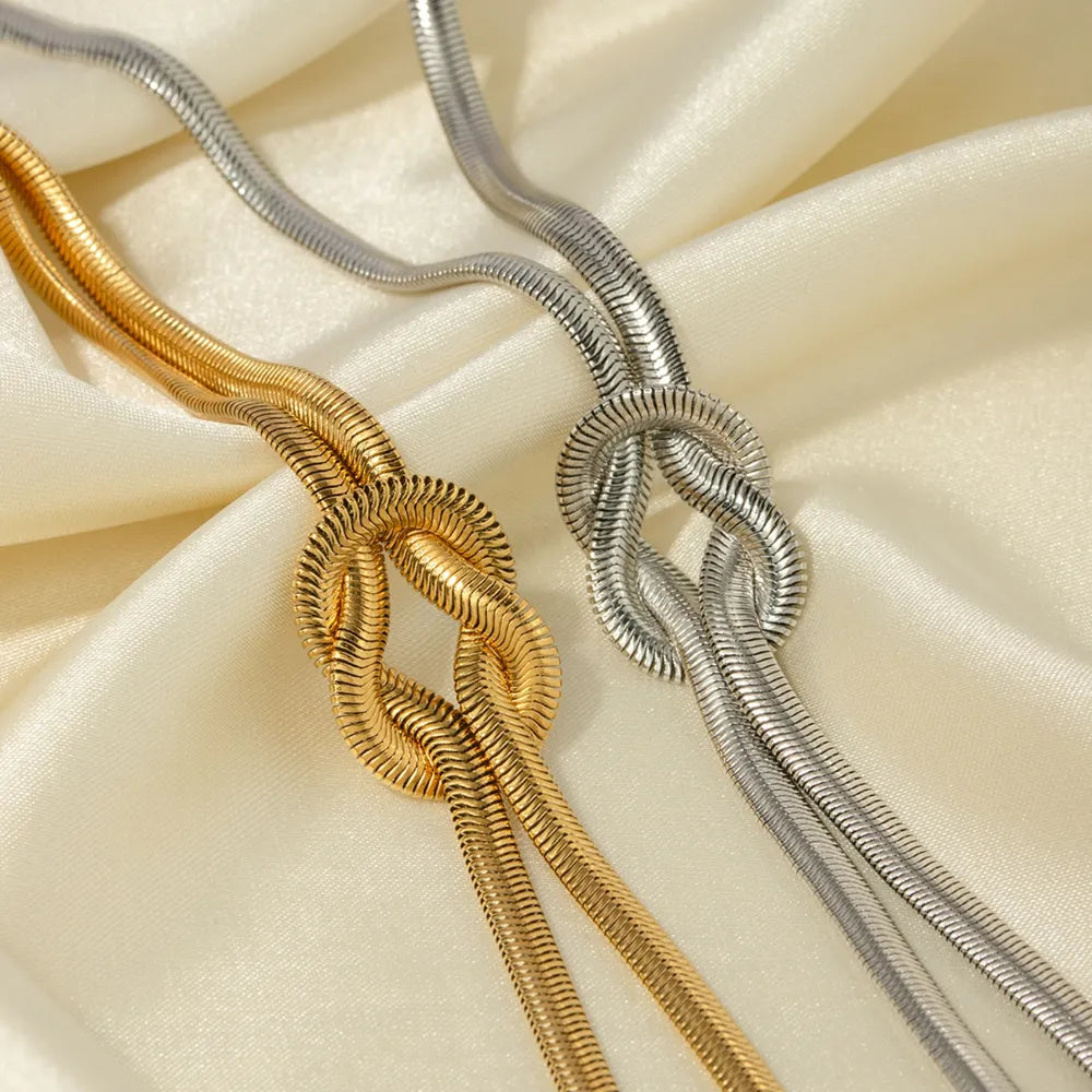 Twisted Layered Knot Gold and Silver Choker Necklace - Close Up View on Cloth - Rebellious Gal  Jewellery