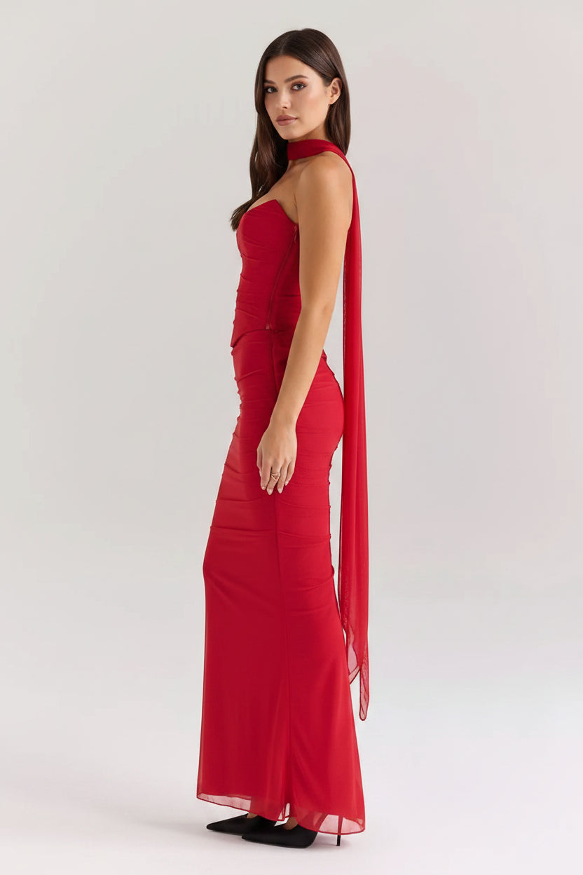 Red evening gown with sheer sleeves on a white background