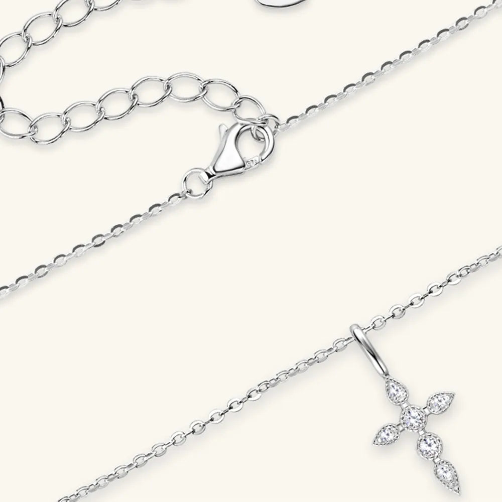 Close-up texture of 18K gold-plated finish and intricate cross details