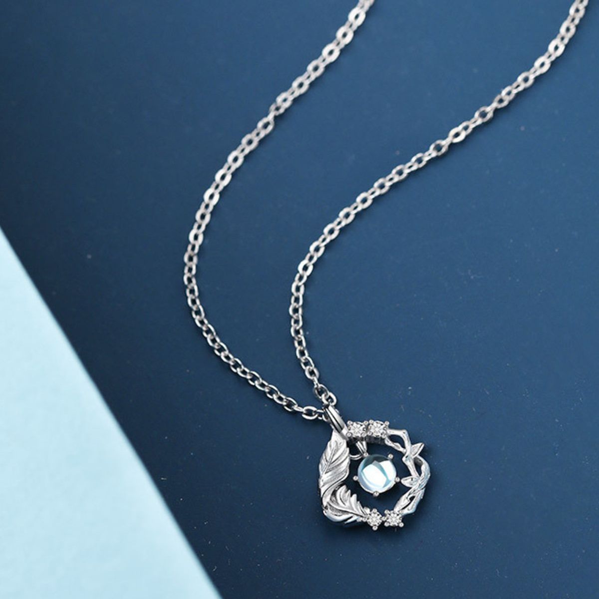 Side profile of zircon pendant necklace showing 15.7" chain and 2" extension