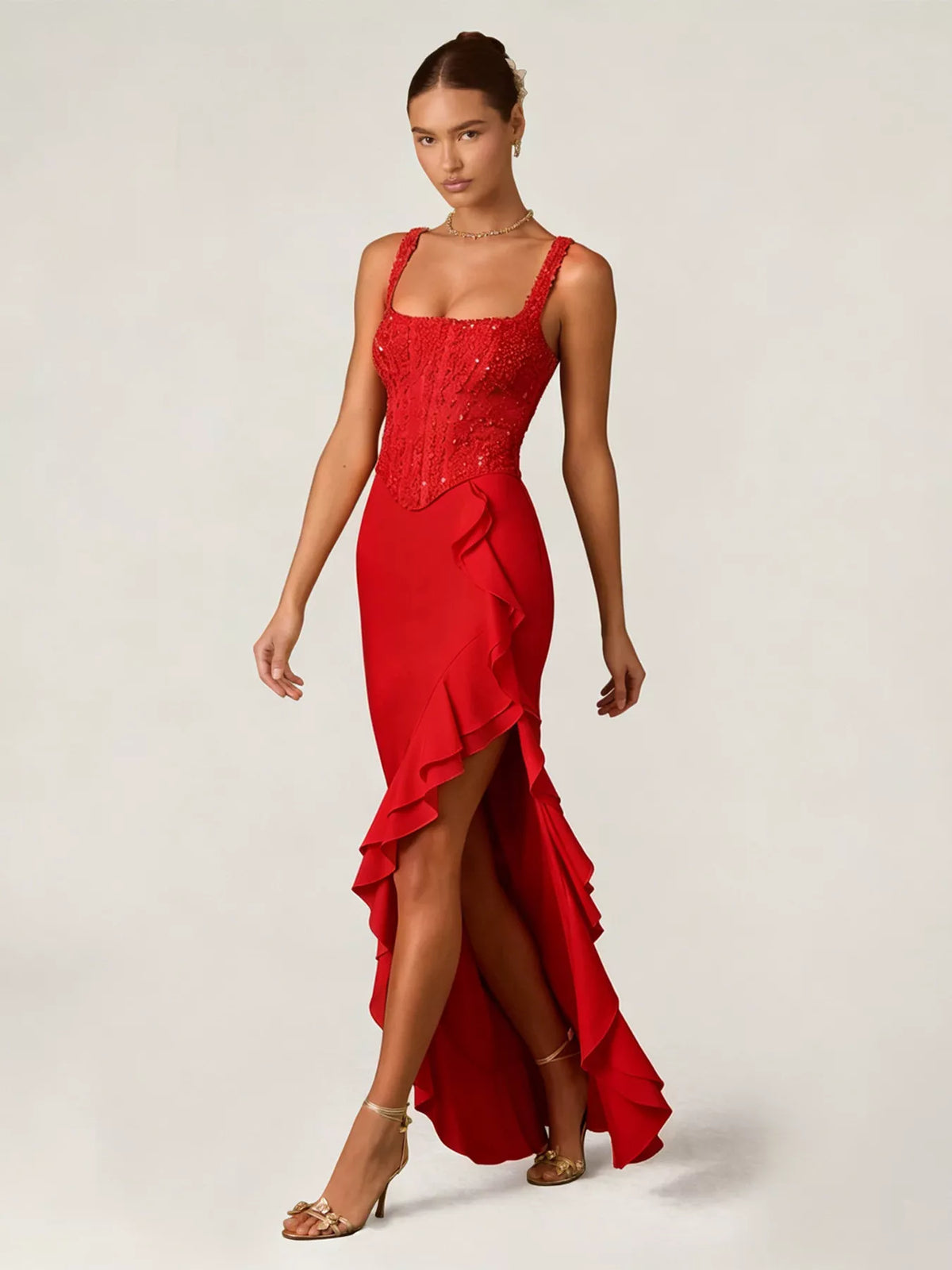 Woman wearing a red evening gown with a white background