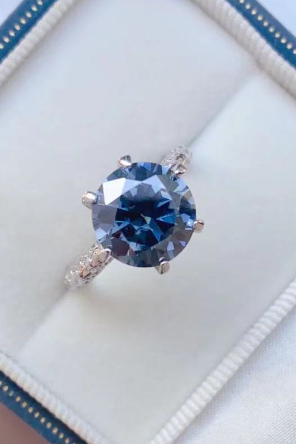 5 carat moissanite ring sparkling under different lights color variation