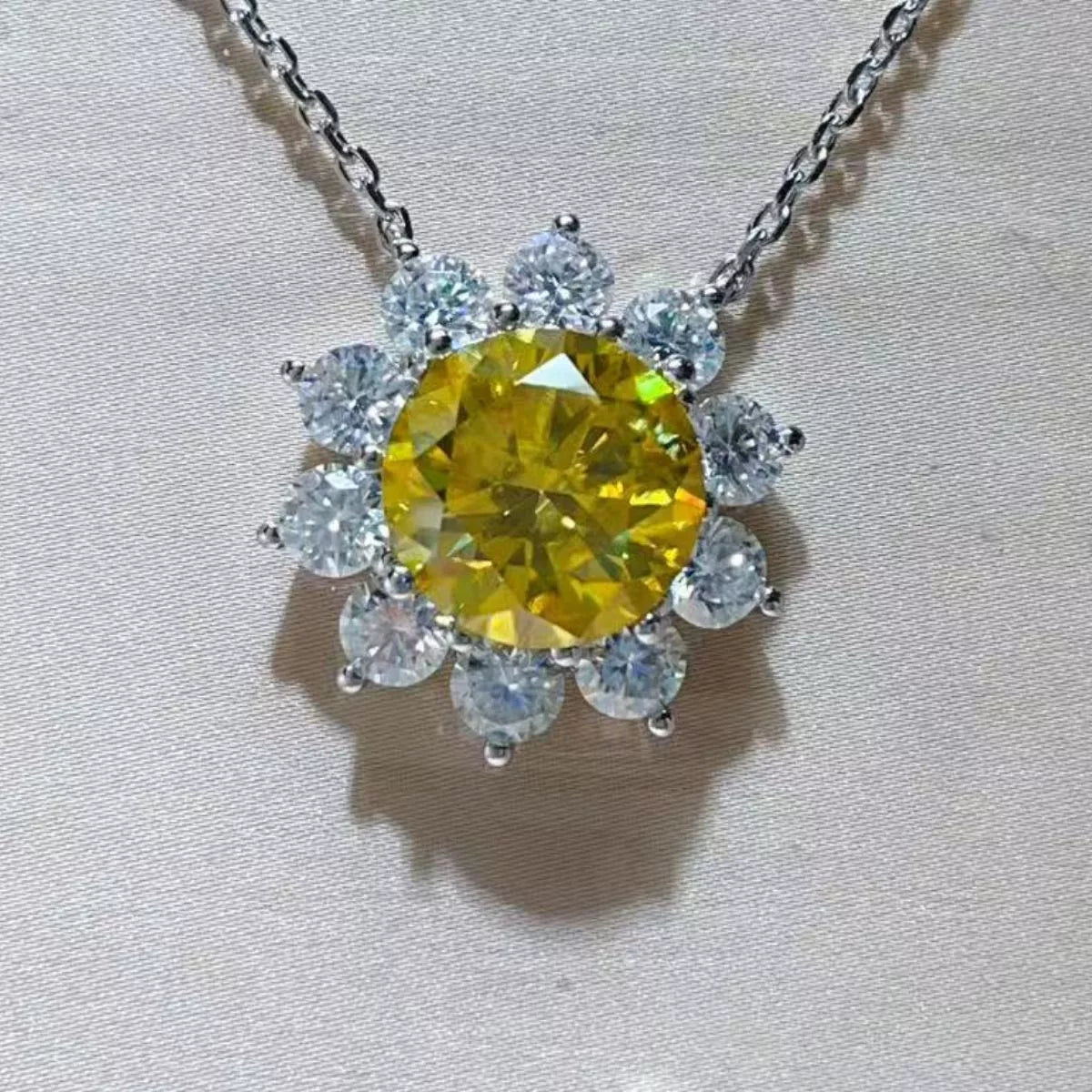 Detail shot of fiery moissanite sparkle and platinum-plated setting