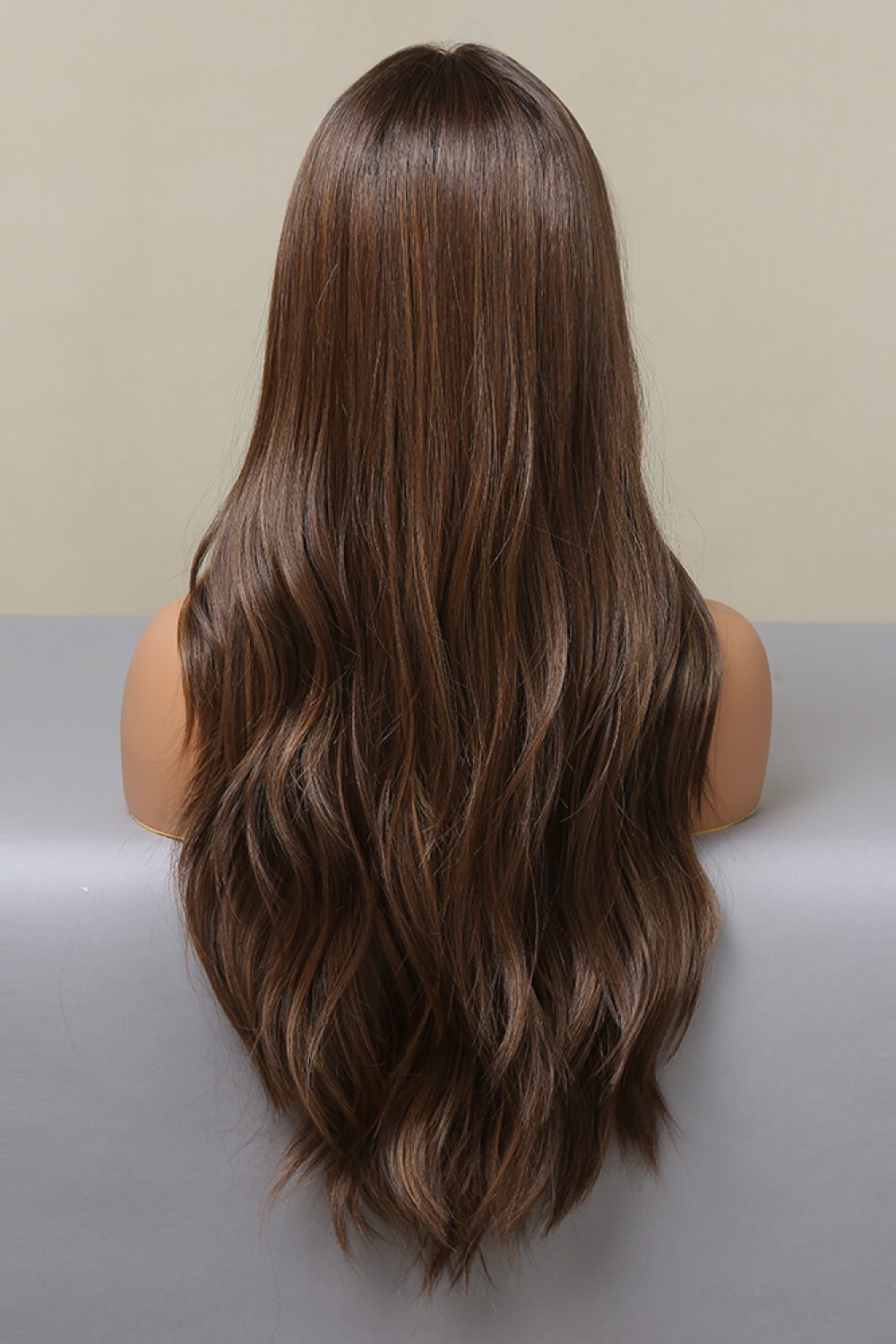 Front view of 26" long wavy synthetic wig with 13x2 lace front on mannequin