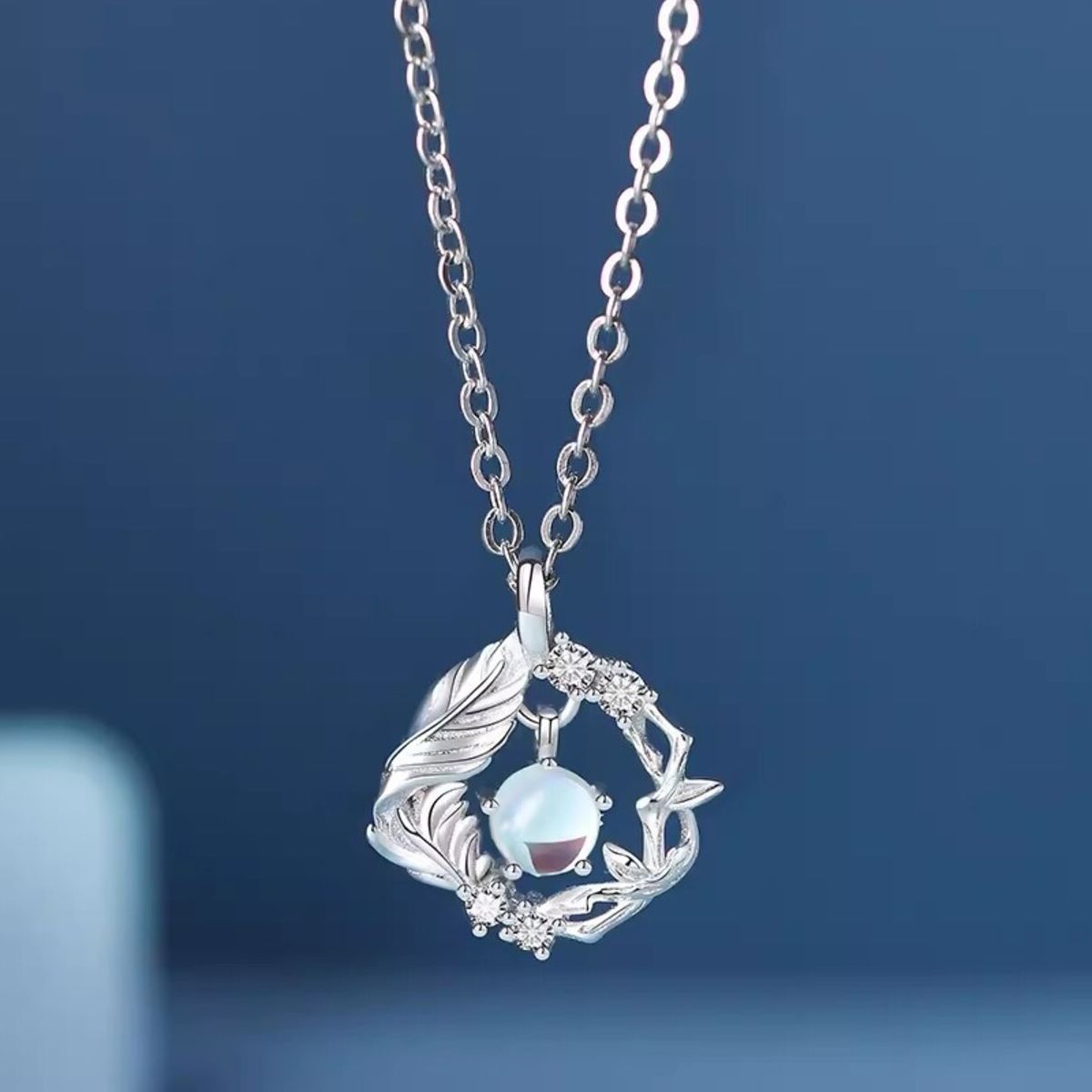 Side profile of zircon pendant necklace showing 15.7" chain and 2" extension
