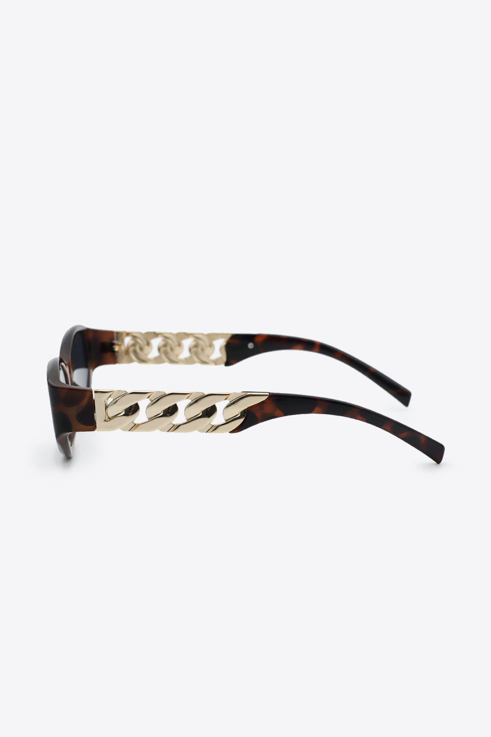 Side profile of cat-eye sunglasses with chain accents