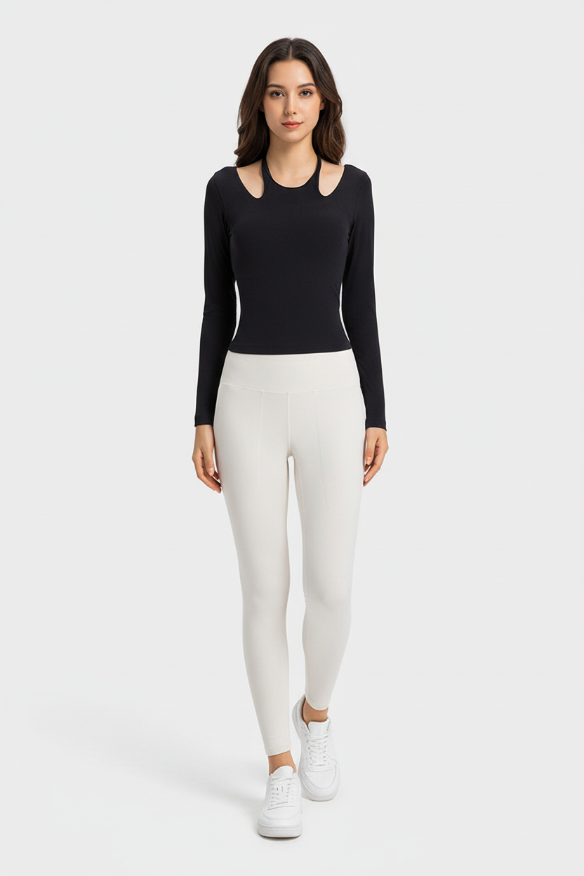 Black cutout shoulder top with ivory high waist leggings, white sneakers, light gray studio