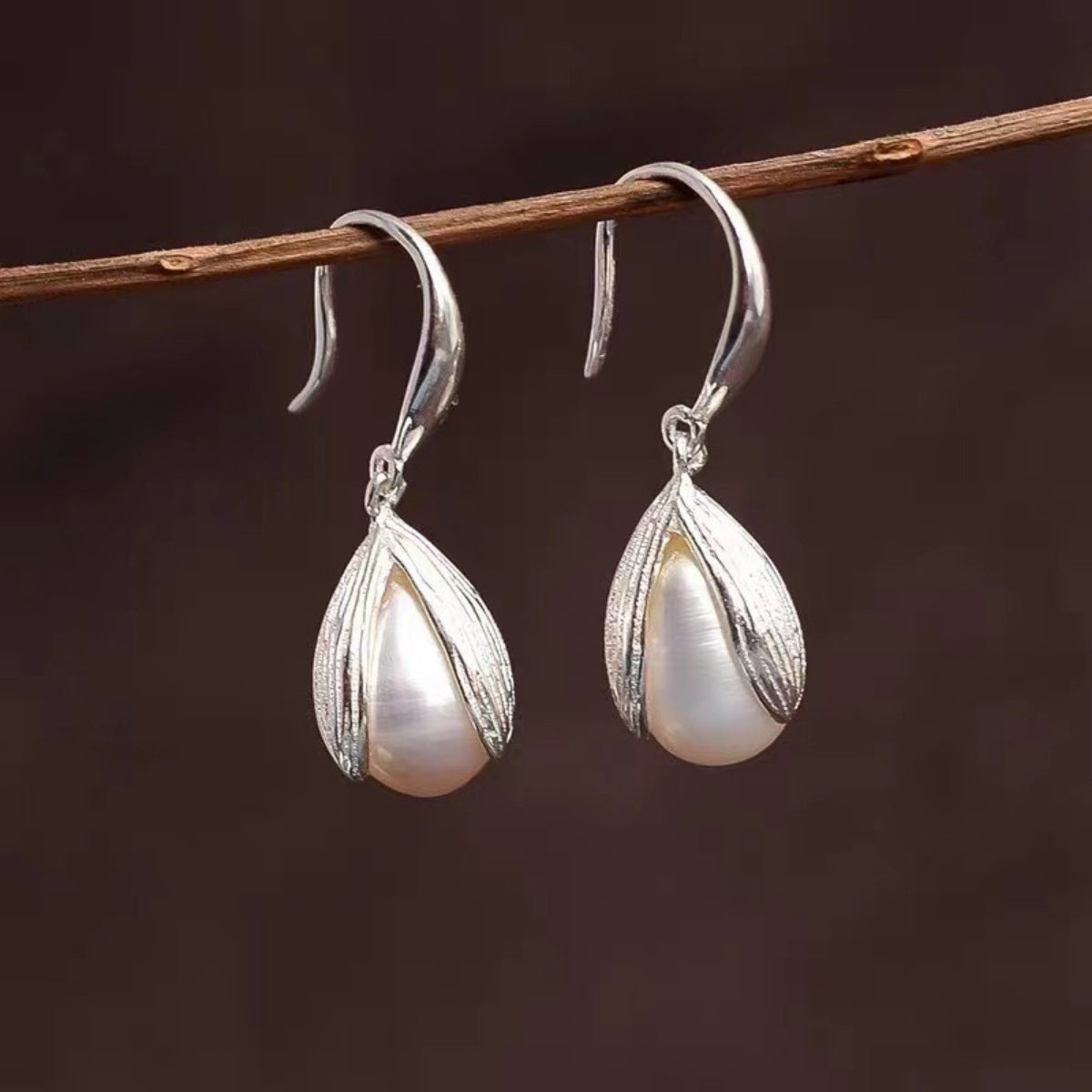 Detail of synthetic pearl and secure sterling silver hook