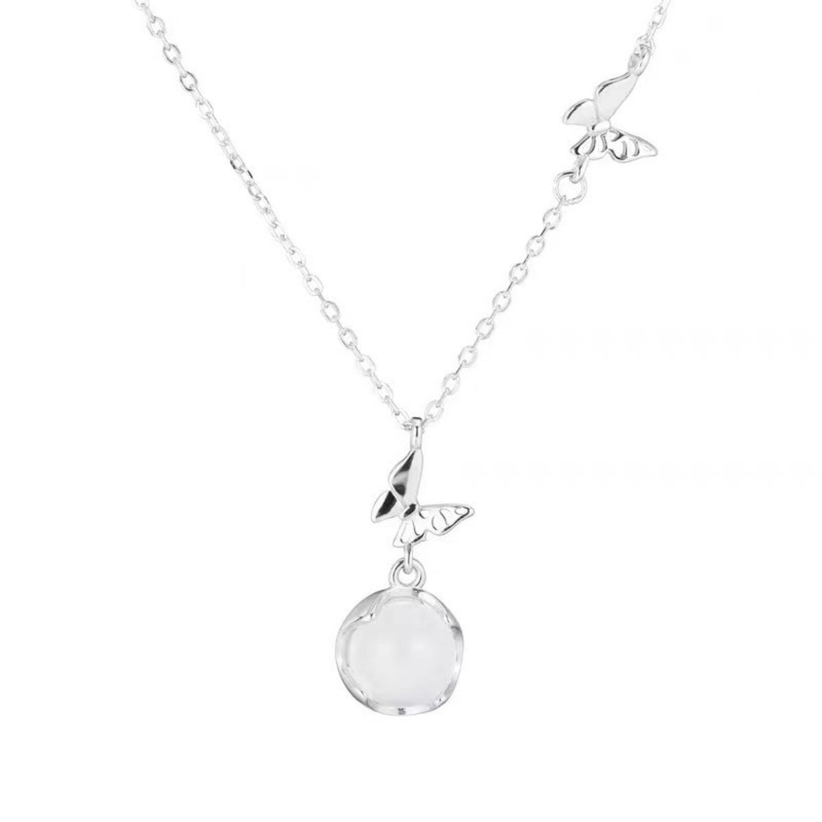 Silver necklace with a round pendant on a white background