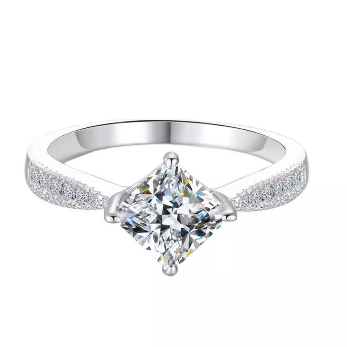 Silver ring with a clear gemstone on a white background