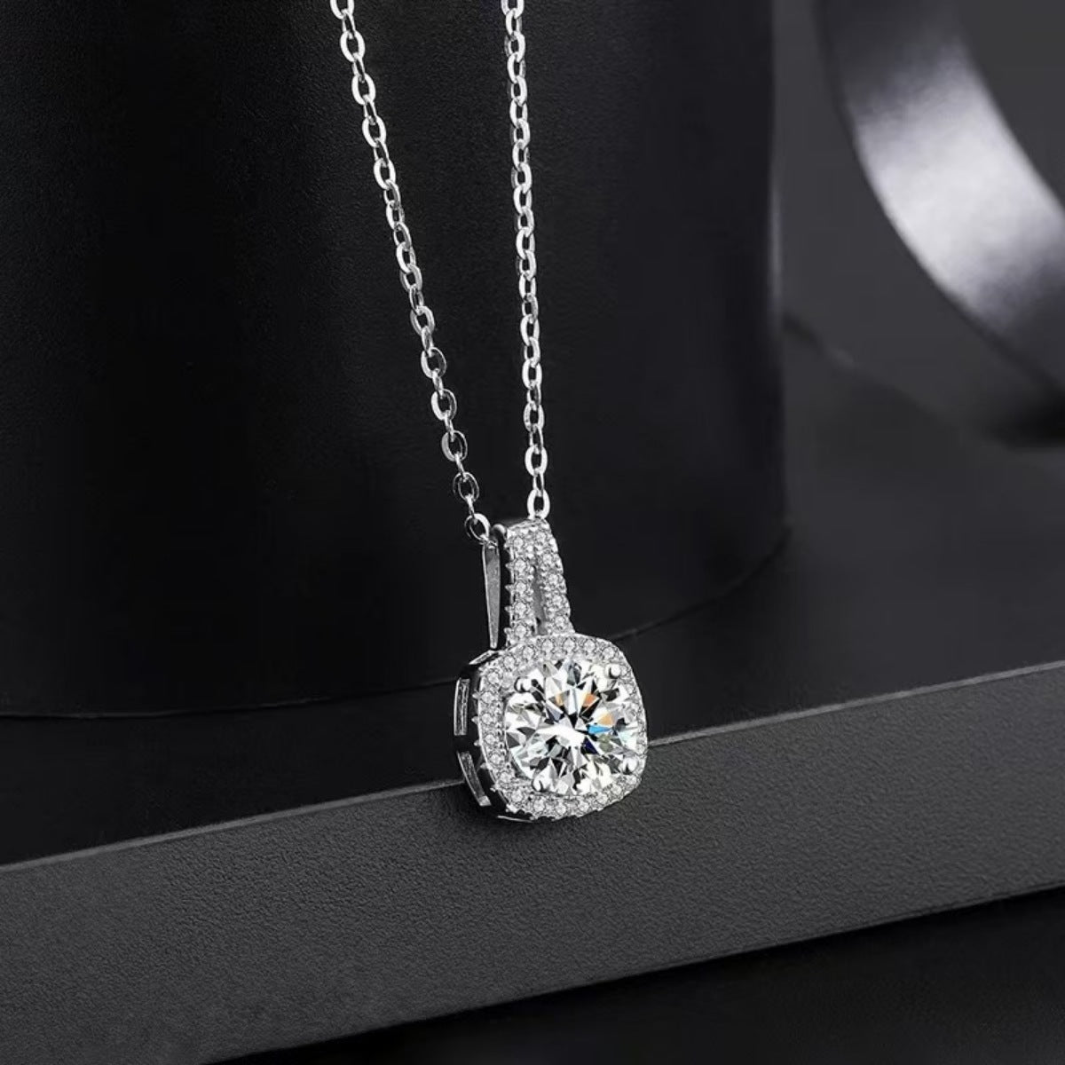 Detail shot of fiery 1 carat moissanite sparkle and polished sterling silver setting