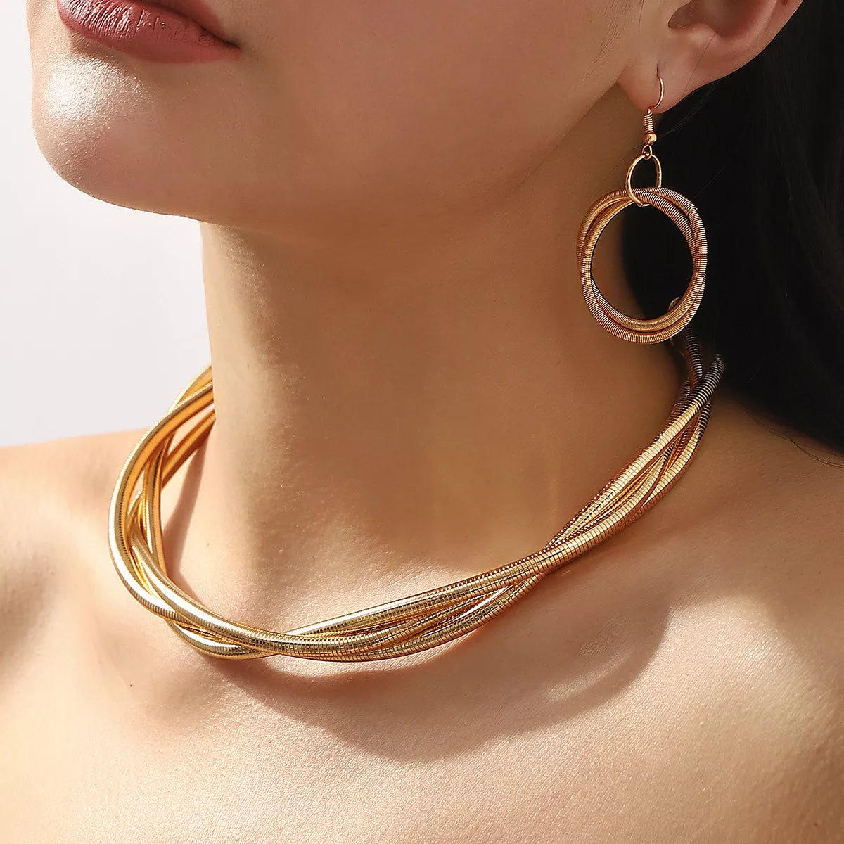 Twisted Metal Earring and Necklace Jewelry Set in Gold Closeup Shot | Rebellious Gal Jewelry Set