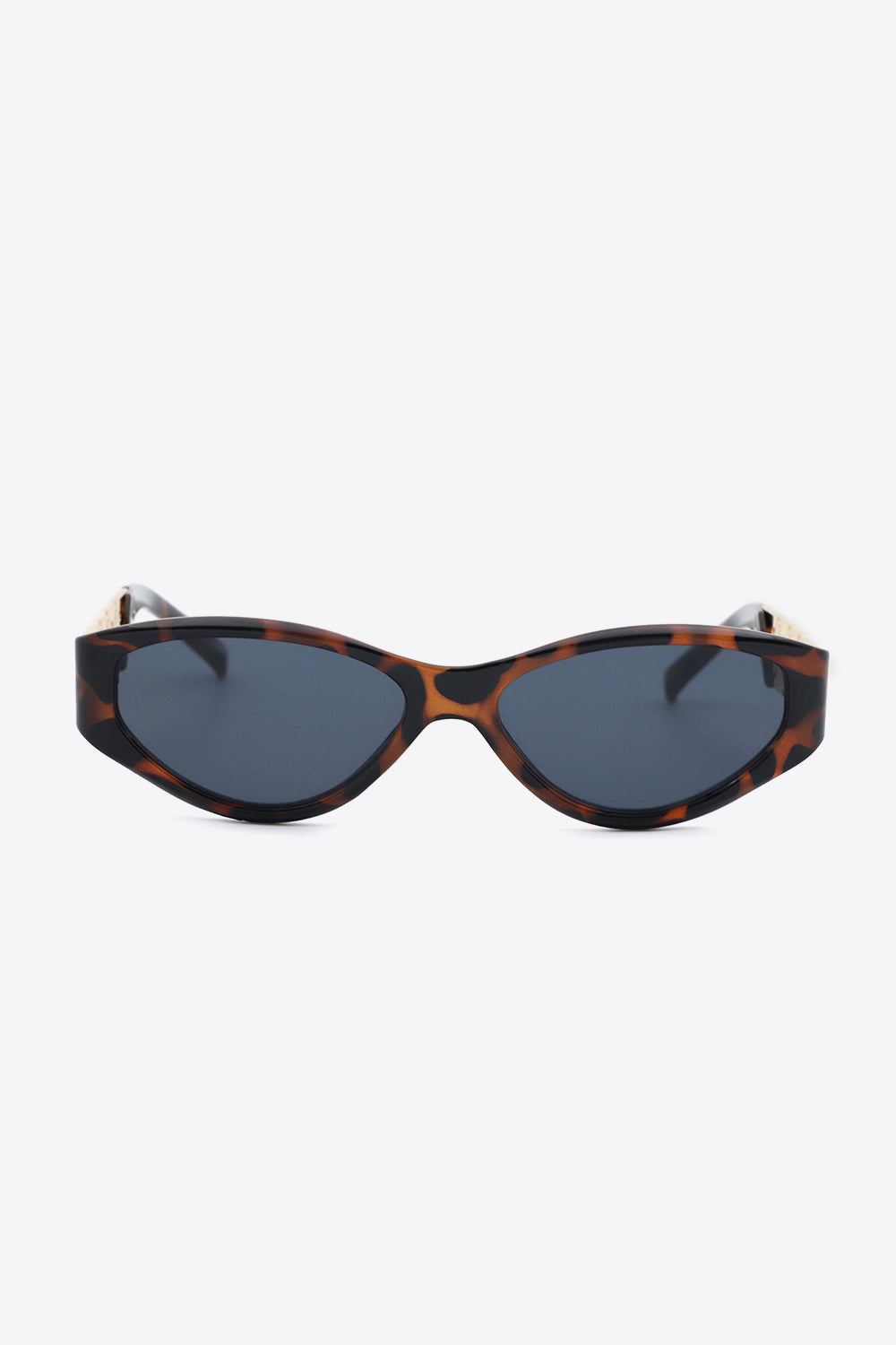 Bold cat-eye sunglasses styled with modern outfit