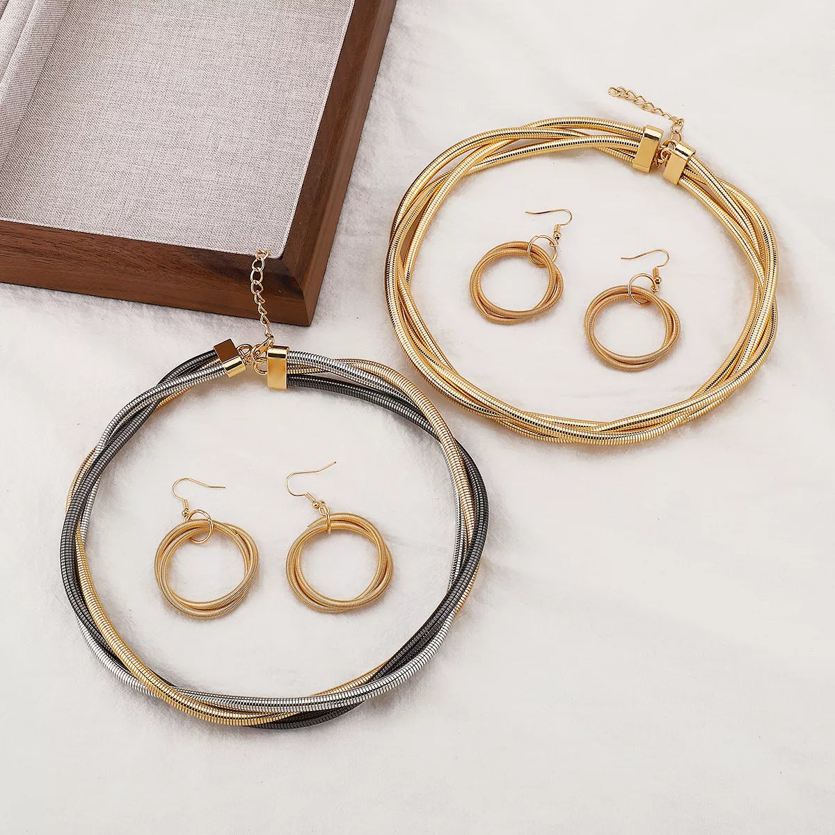 Twisted Metal Earring and Necklace Jewelry Set on Flat Surface Display| Rebellious Gal Jewelry Set