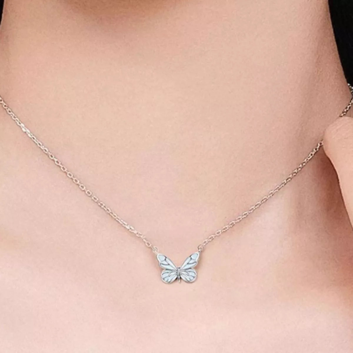 Side profile of butterfly necklace showing 15.7" chain and 2" extension