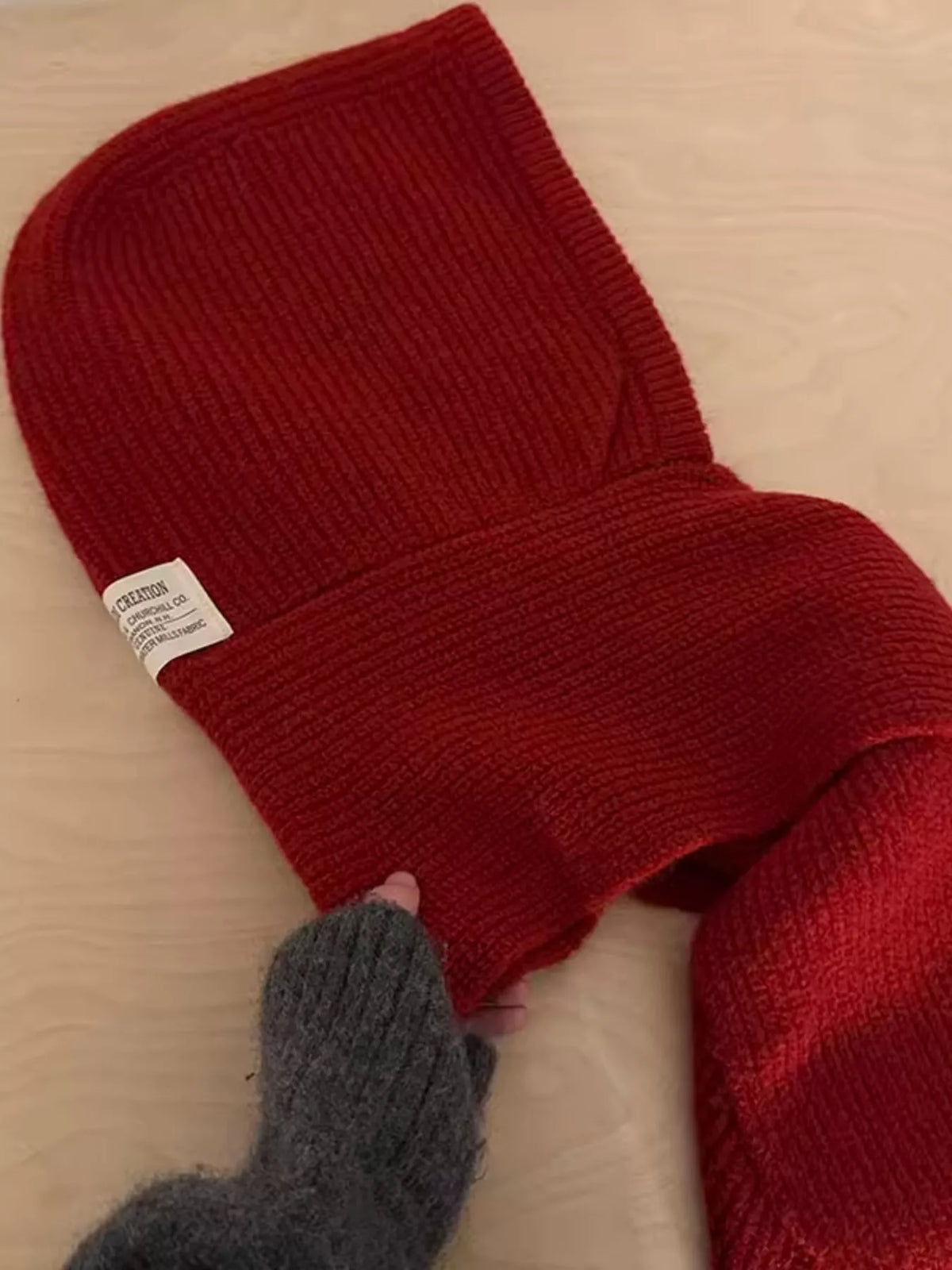 Long scarf tails draped on knitted hat beanie combo fierce cold weather look