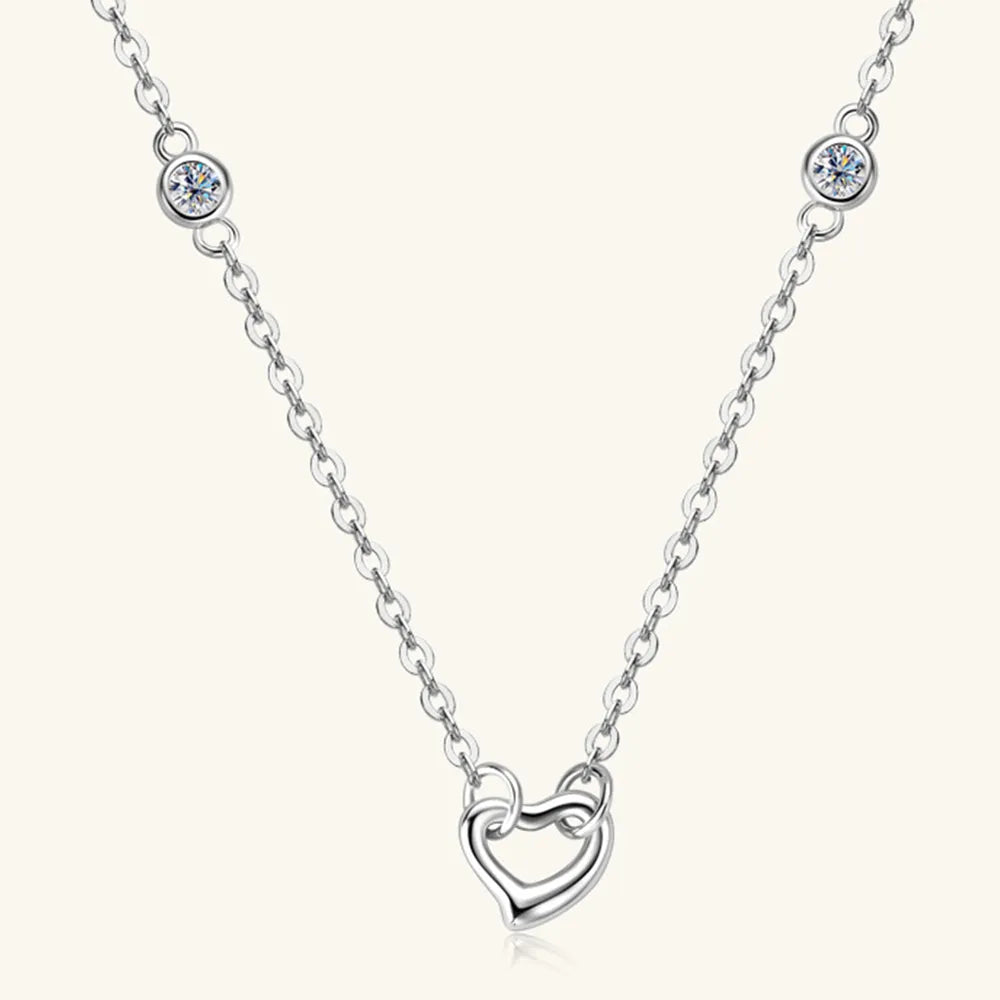Close-up of 0.06CT D color VVS1 moissanite heart stone sparkling on chain