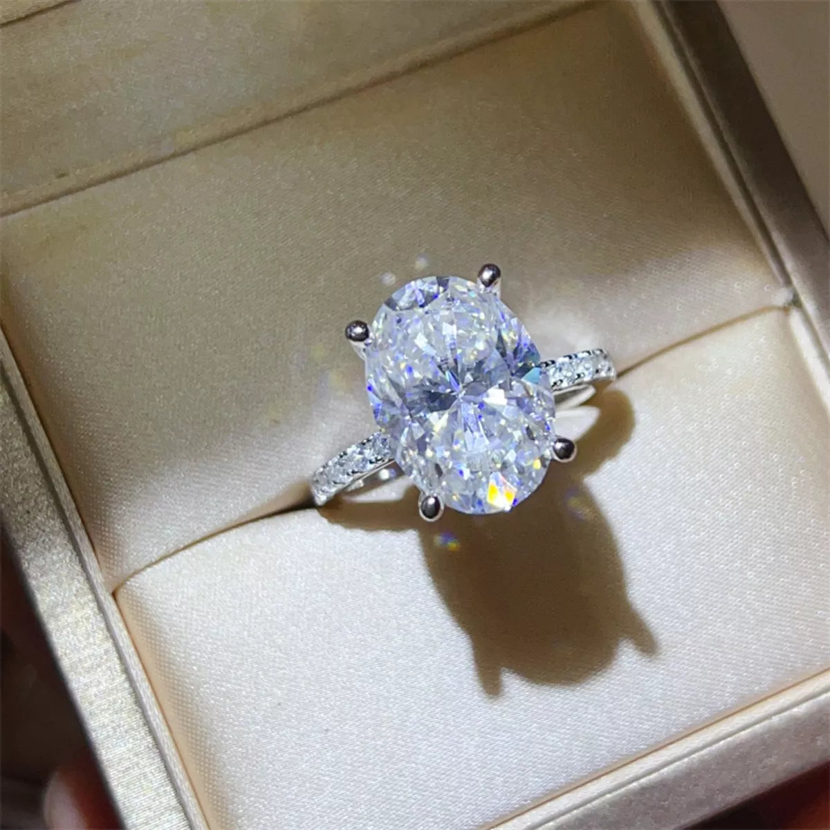 Oversized 8 carat moissanite ring sparkling under natural sunlight