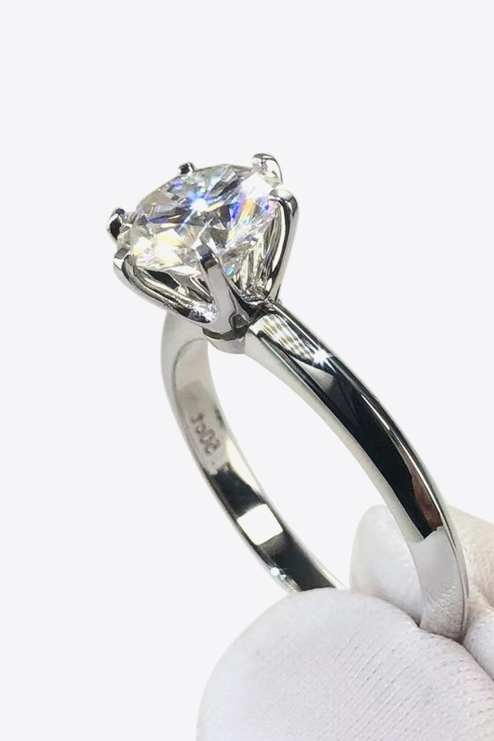 Platinum plated moissanite engagement ring alternative size 7 on model hand