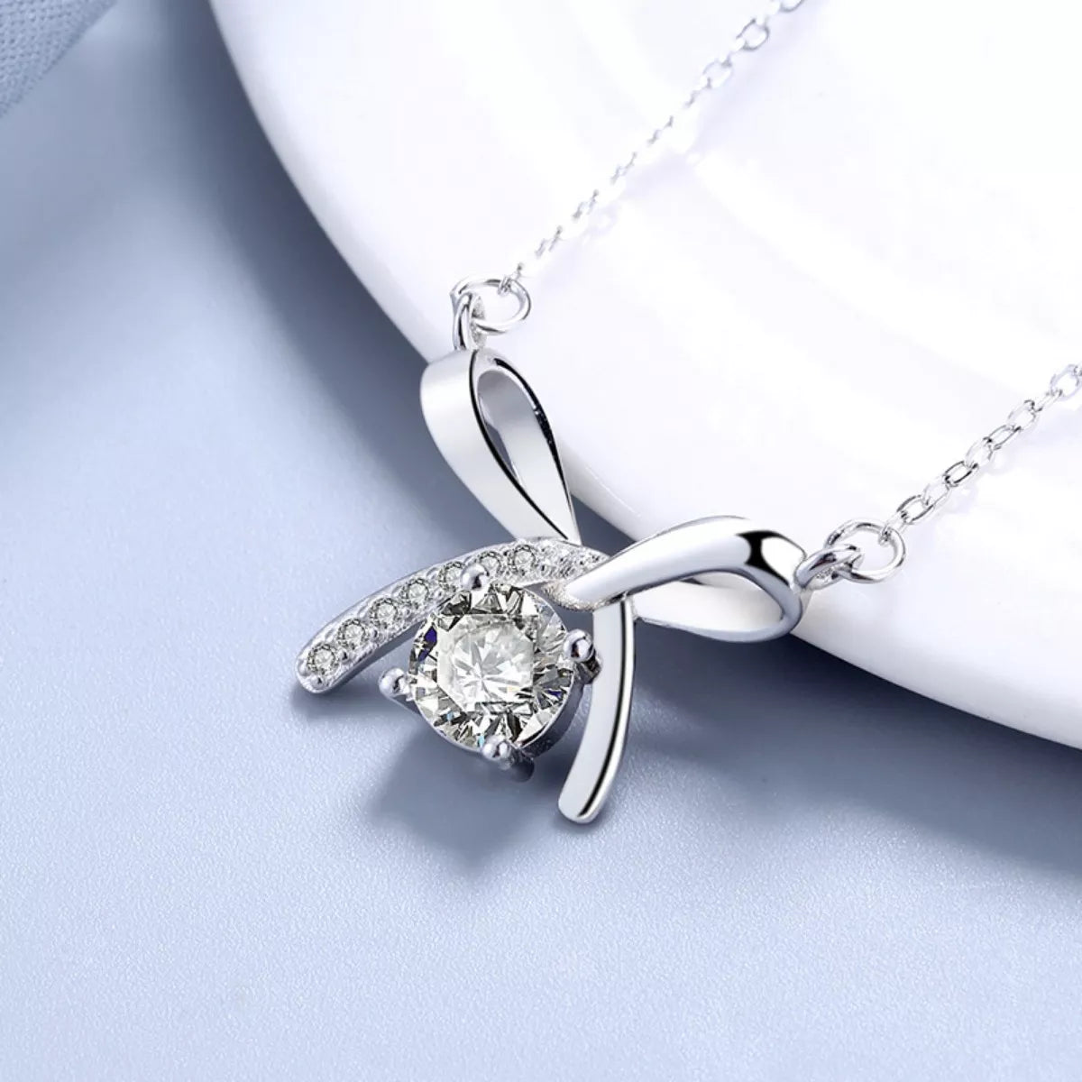 Lifestyle image: Rebellious Gal ribbon pendant necklace styled with edgy outfit