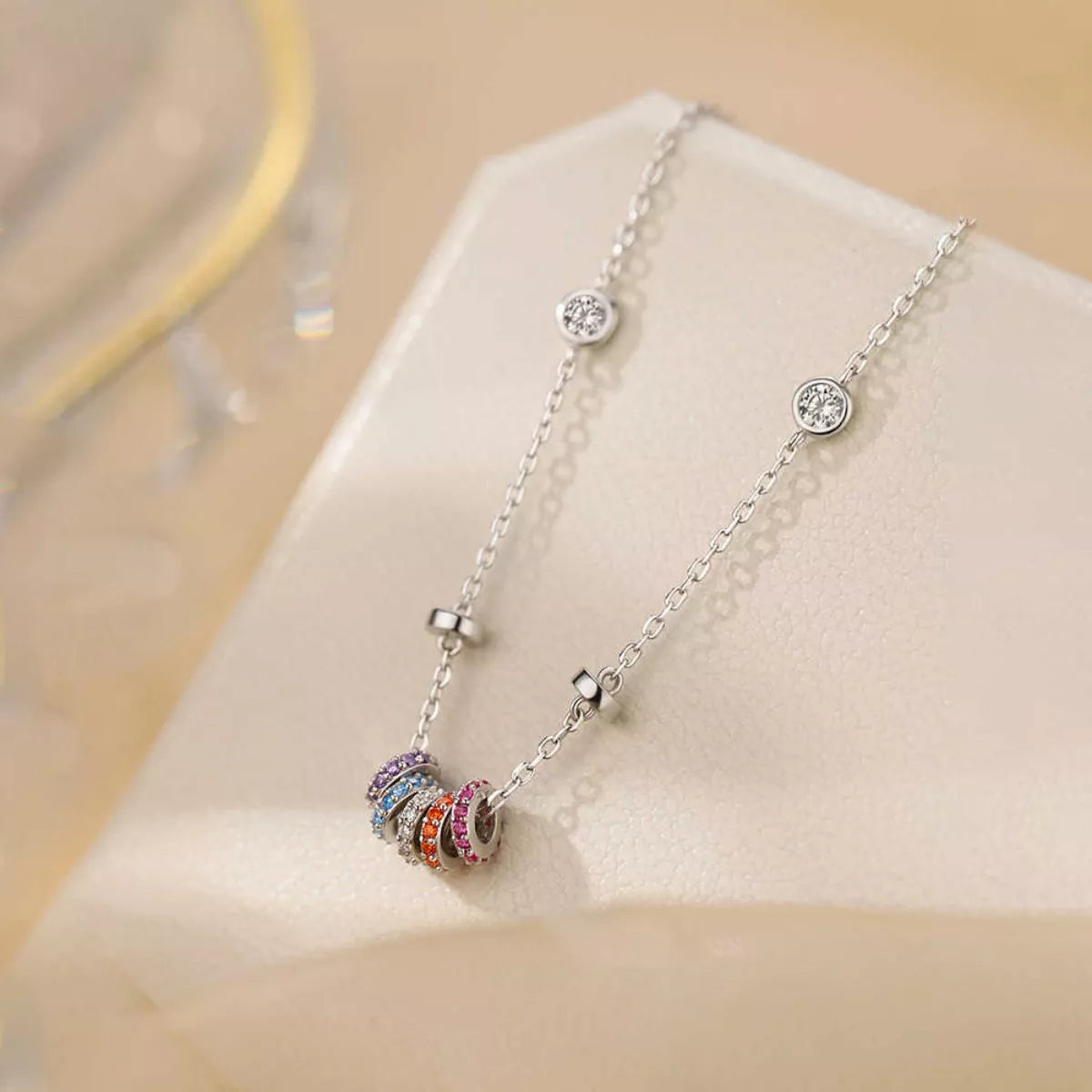 Close-up of sparkling zircon stone in 18K rose gold-plated sterling silver pendant