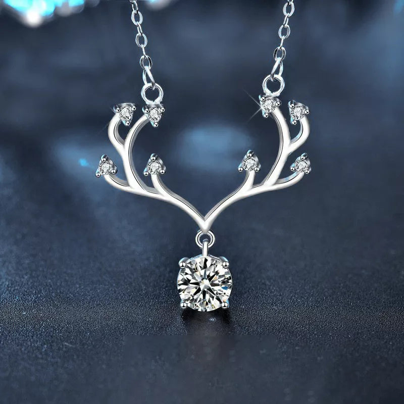 Reindeer Necklace with Diamond Gem Display Hanging On Table - Rebellions Gal 