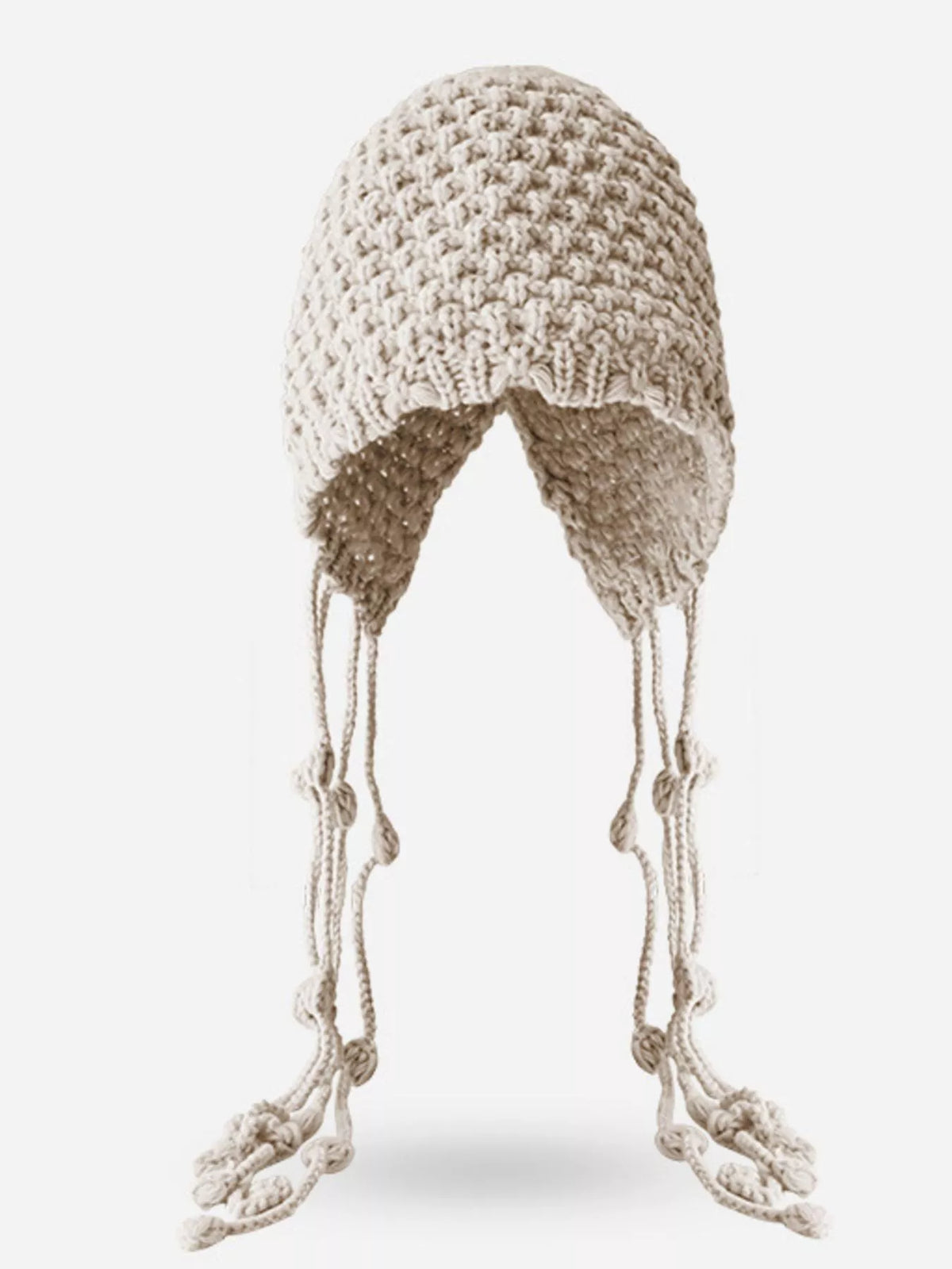 Fringe accents swaying on plush knitted beanie hat fierce cold weather look