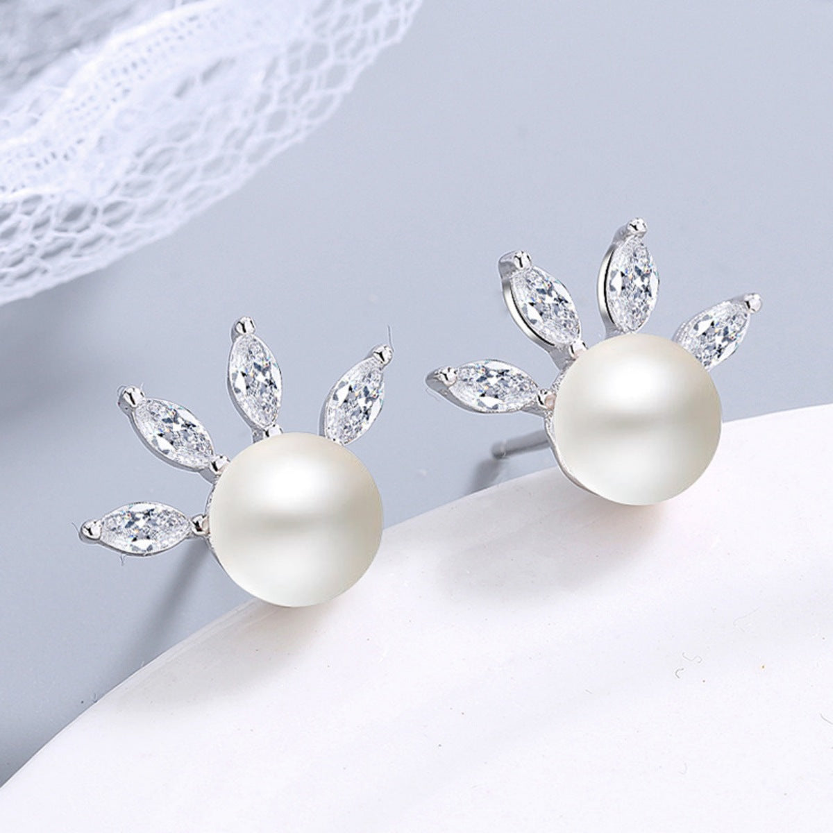 Freshwater pearl stud earrings with zircon halo in 925 sterling silver