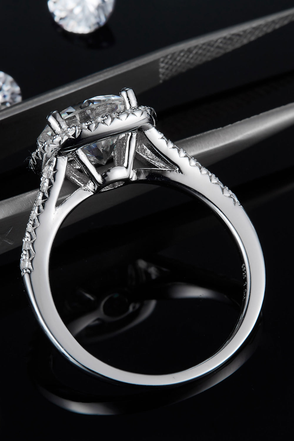 Rebellious Glow 3 carat moissanite halo ring full view on black background