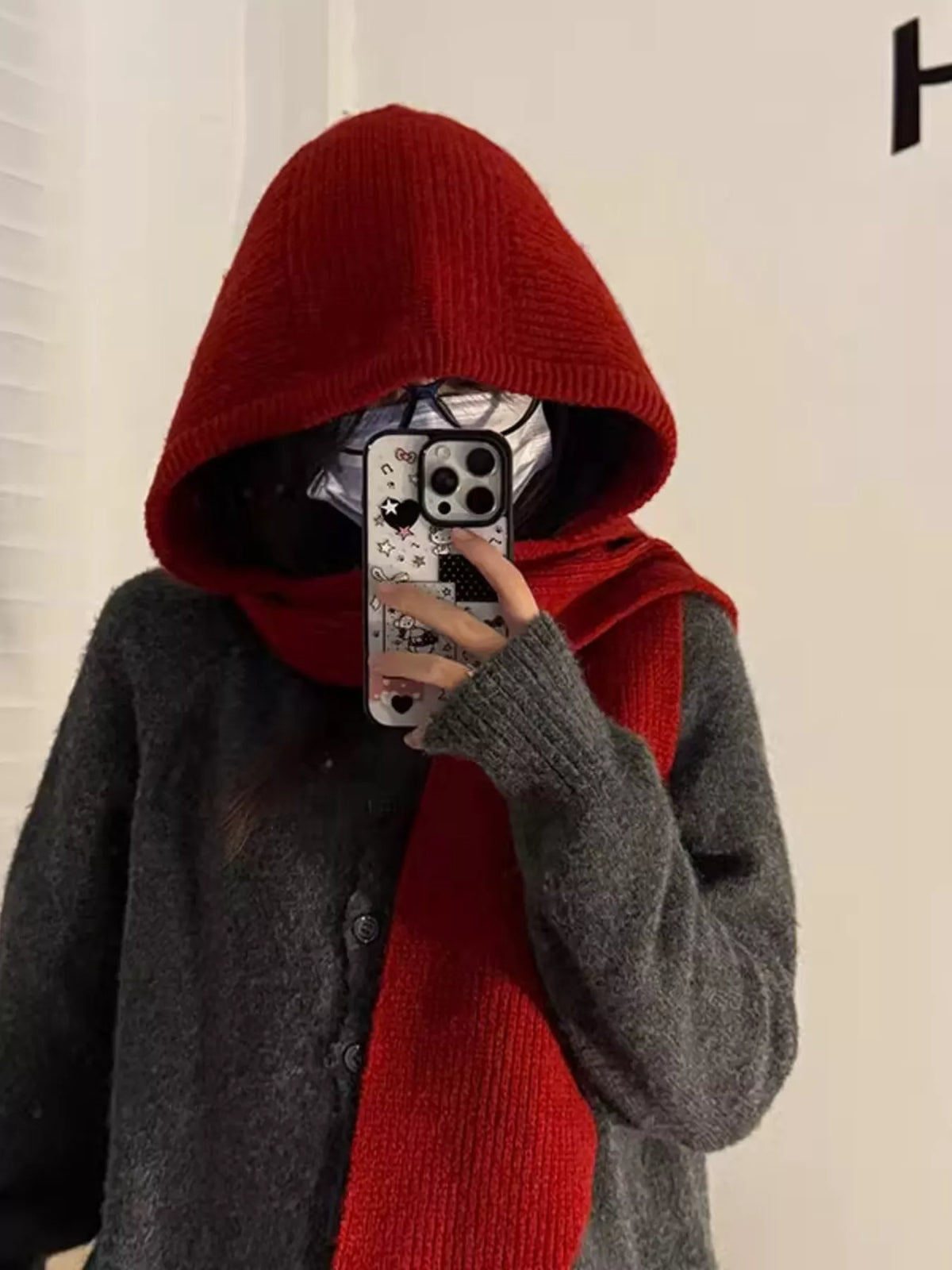 Rebellious Gal model in knit hat scarf combo layered over edgy jacket