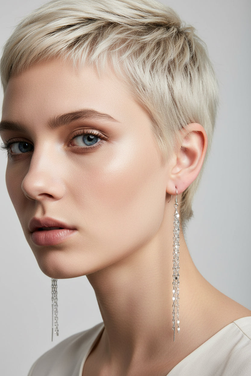 Pair of silver threader earrings on rebellious gal model