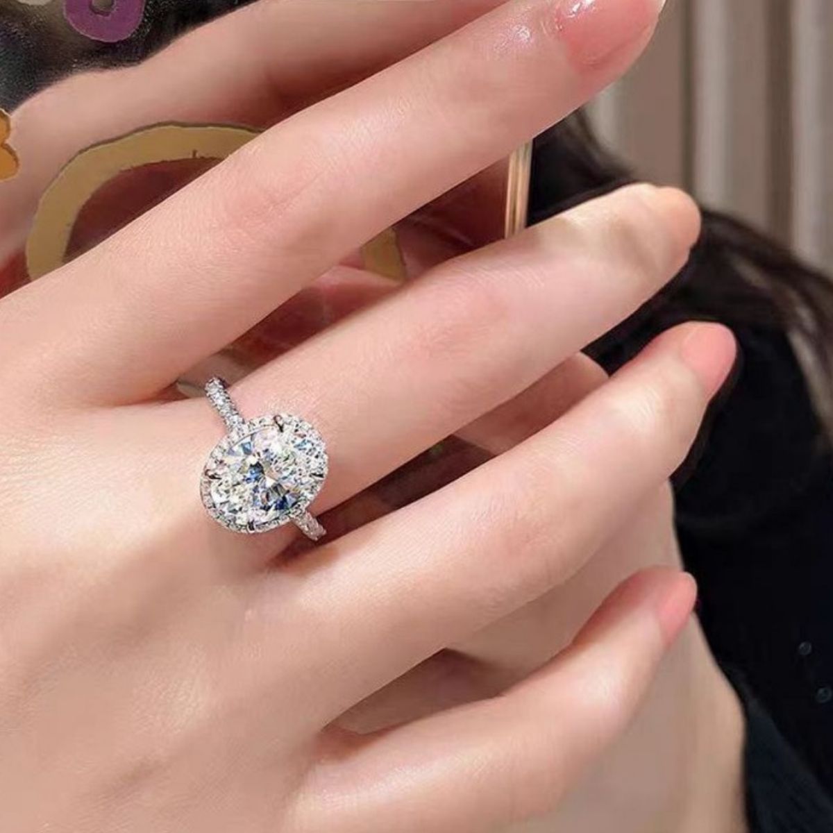 Overhead shot of one-size 0.7" moissanite oval ring displaying elegant design