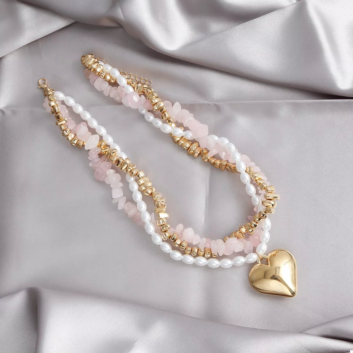 Heart pendant necklace shown against white background