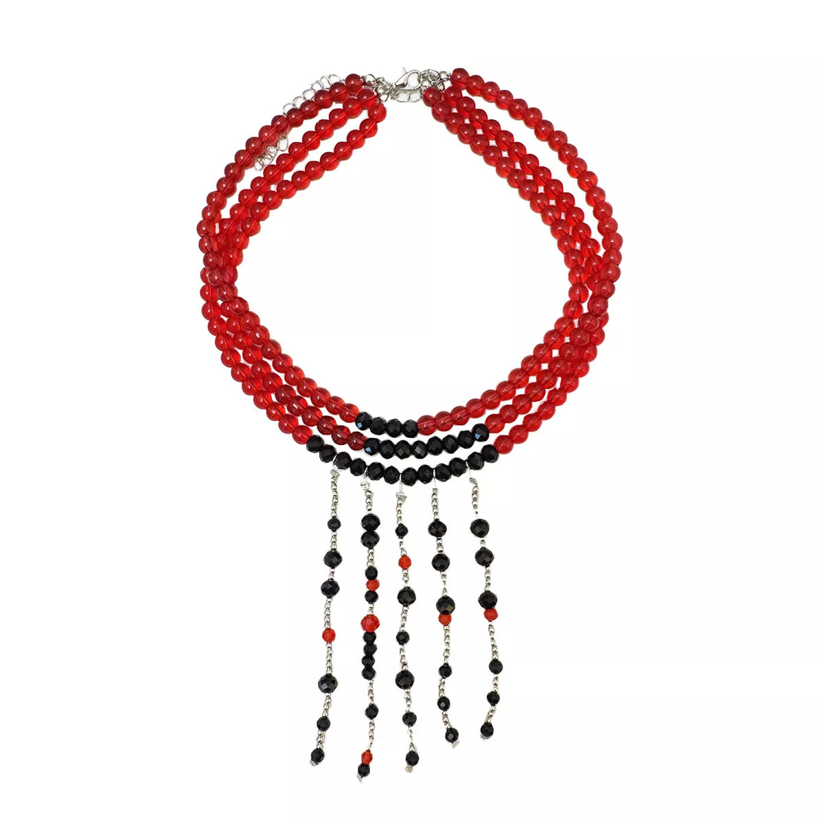 Three-strand red bead choker with five black beaded fringe strands, flat lay on white