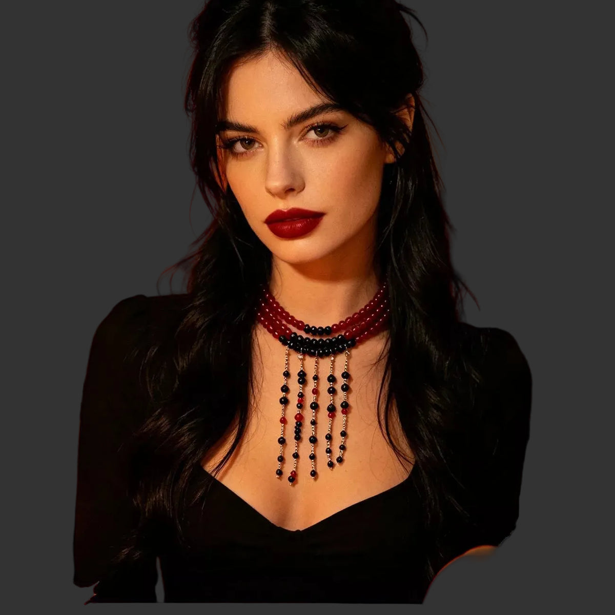 Red bead choker with black beaded fringe worn with a black top