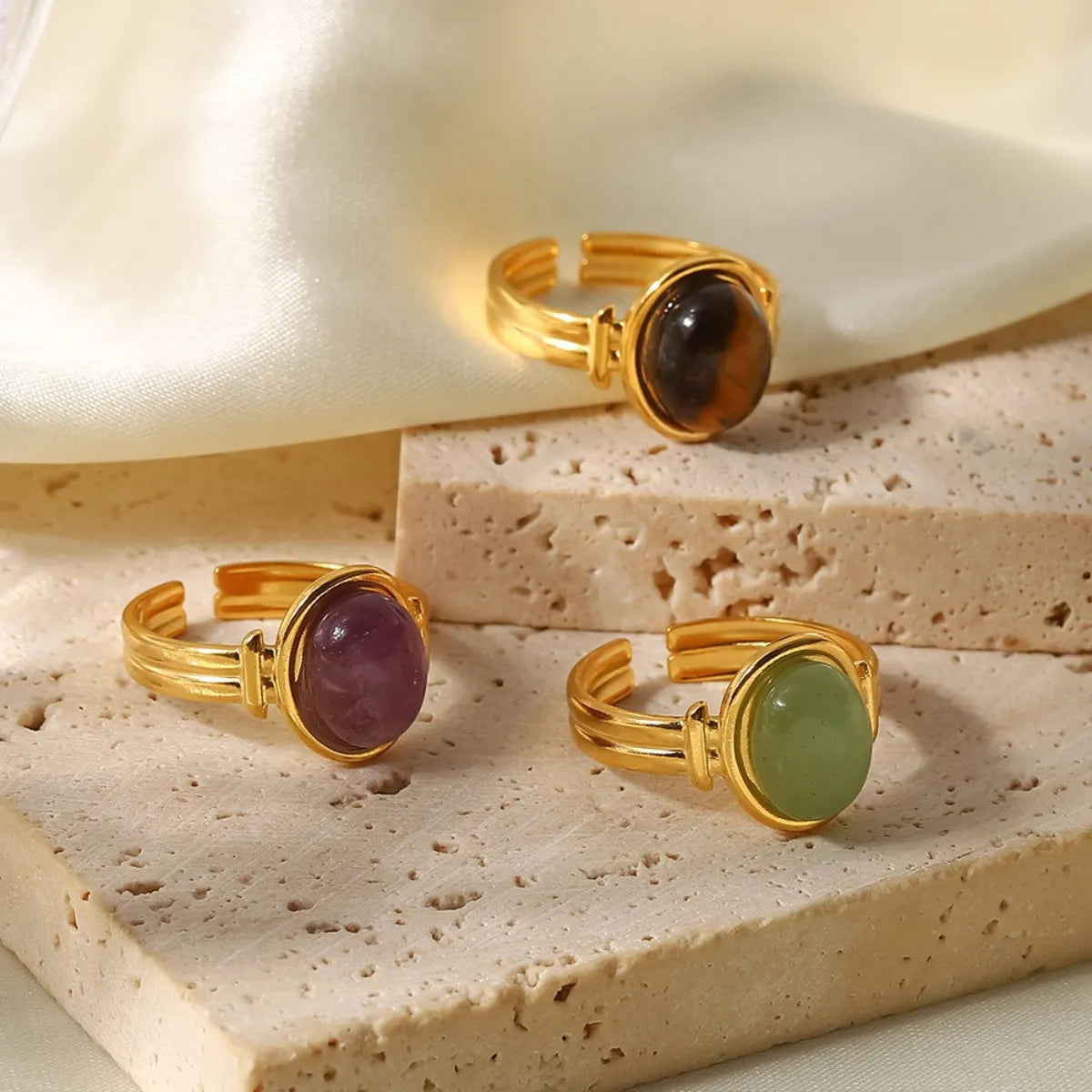 Close-up natural tiger's eye adjustable ring gold plated chatoyant bands