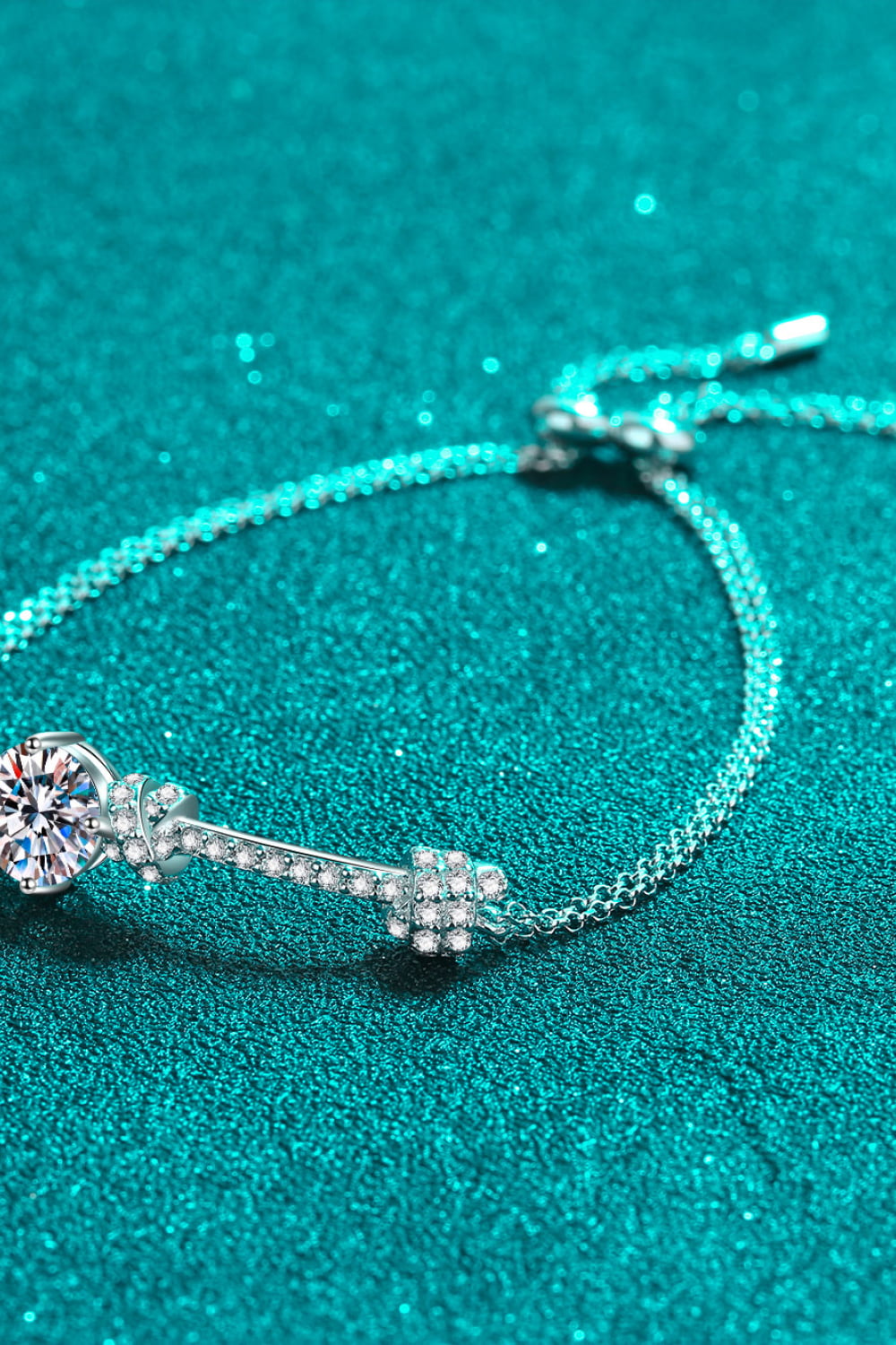 Detail shot of sparkling 2 carat moissanite and rhodium-plated sterling silver