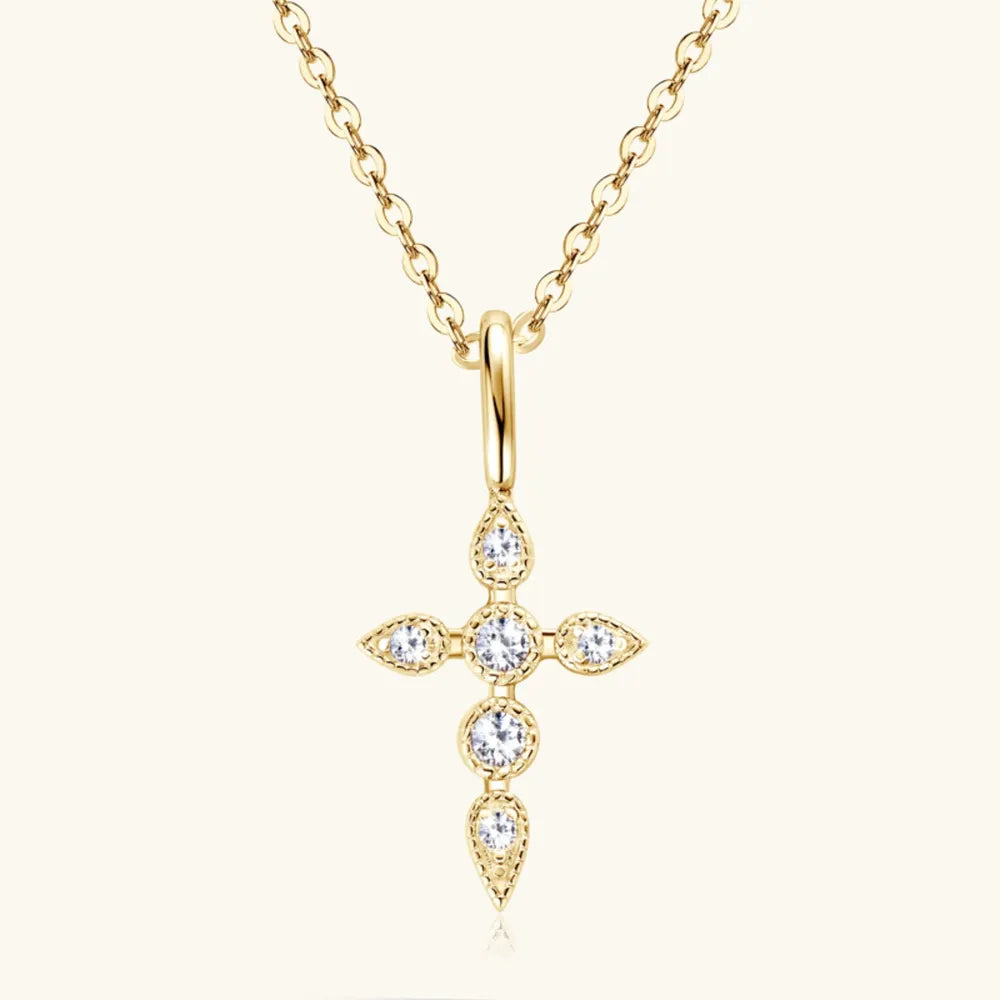 Close-up of 0.1 carat D color VVS1 moissanite set in 18K gold-plated cross pendant