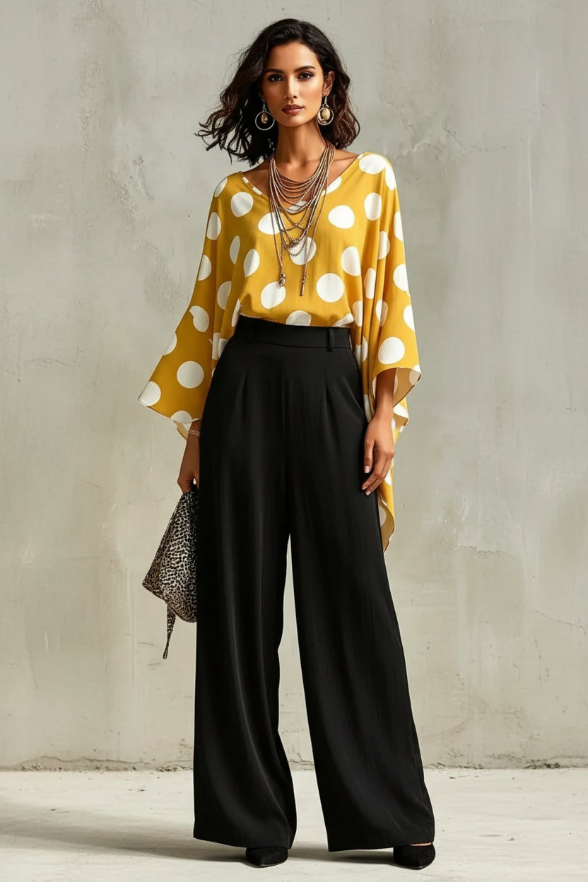 Woman wearing a yellow polka dot top against a neutral background