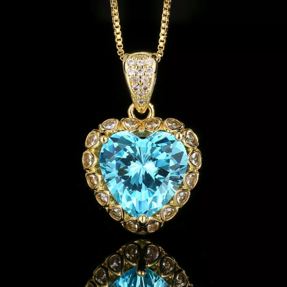 Rebellious Gal heart shaped aquamarine pendant necklace 18K gold plated on black background