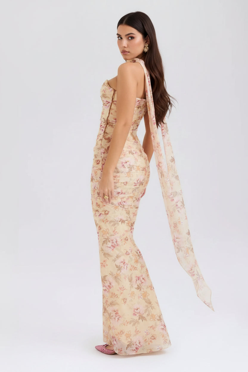 Floral dress with a sheer overlay on a white background