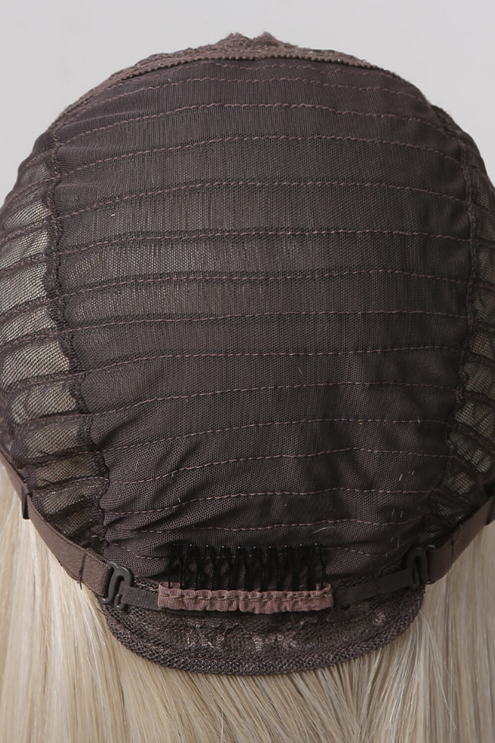 Detail shot of glossy straight synthetic hair texture on Rebellious Gal 27" wig