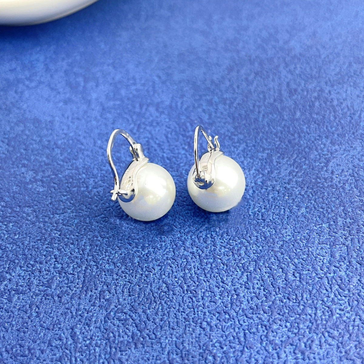 Lifestyle image: Rebellious Gal pearl earrings styled with edgy casual outfit