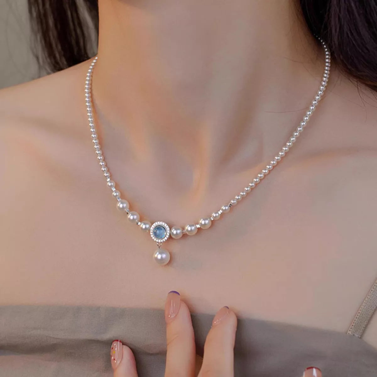 close up of model wearing Rebellious Gal pearl necklace with rebellious layered look