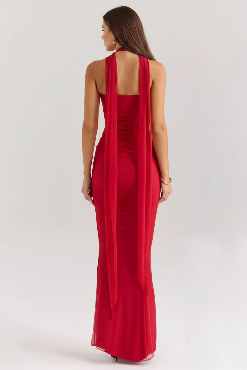 Red evening gown with open back on a white background
